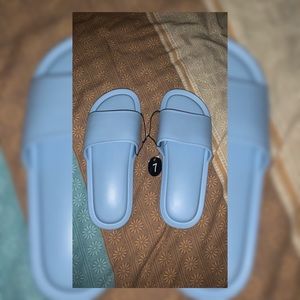 Women baby blue slippers size 7 supper comfortable and never worn!